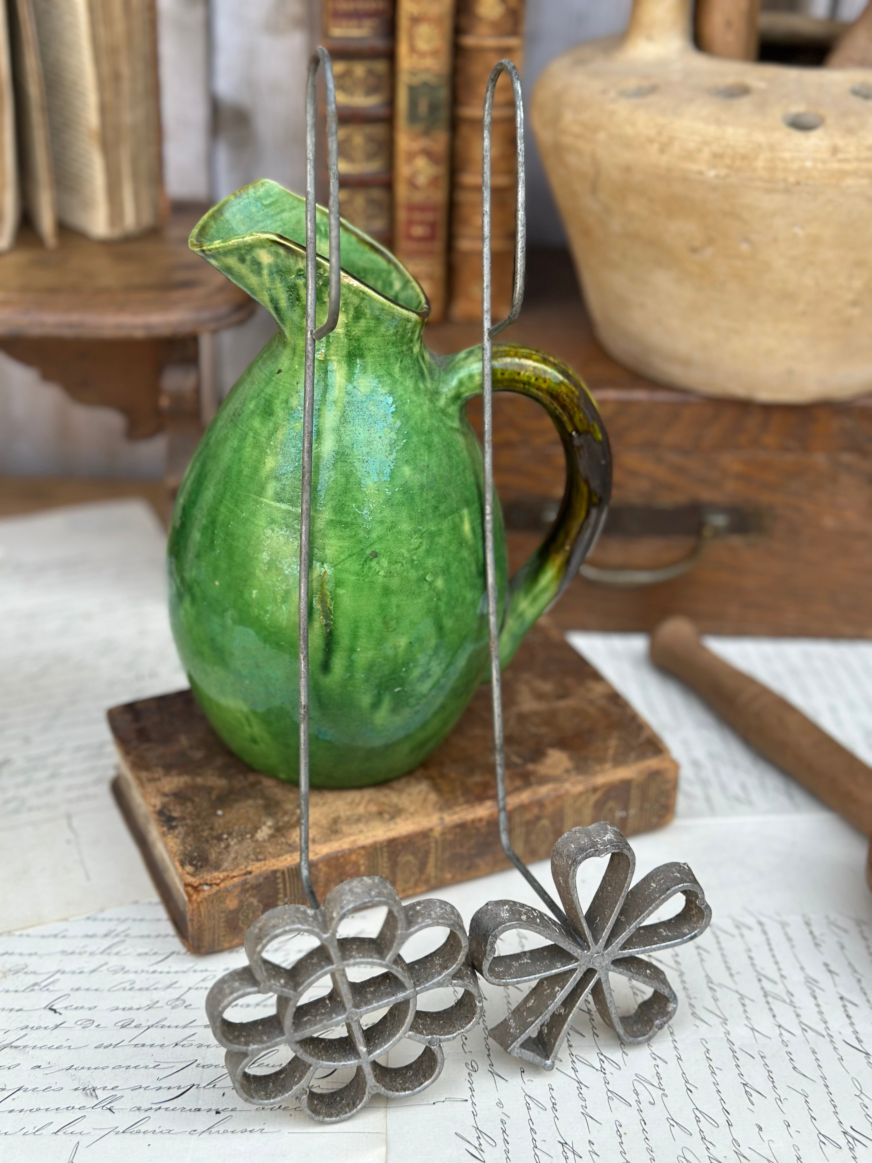 Two antique doughnut molds