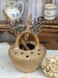 Old terracotta foot warmer