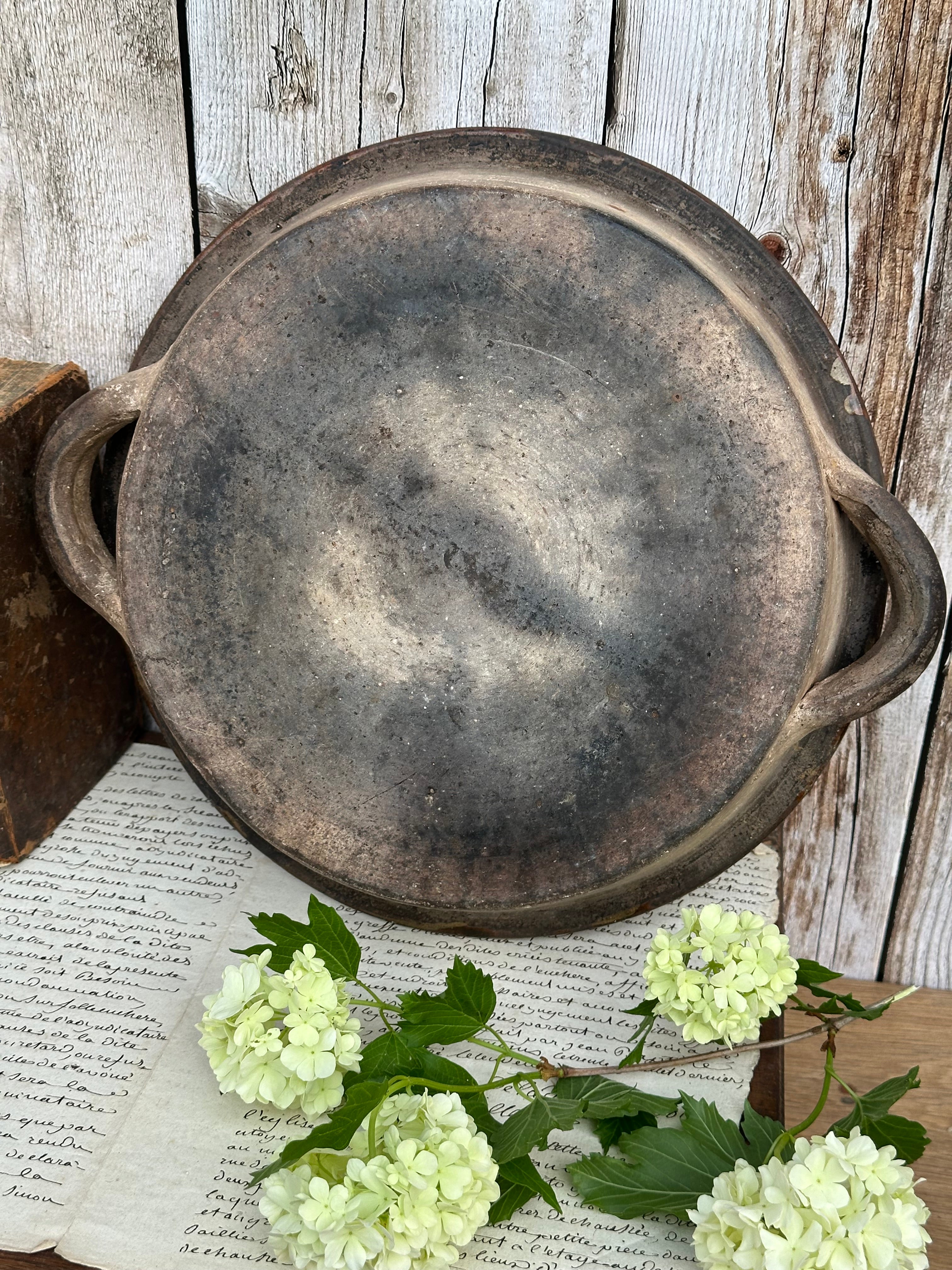 Patinated glazed dish, signed Vallauris, diameter 27.6cm