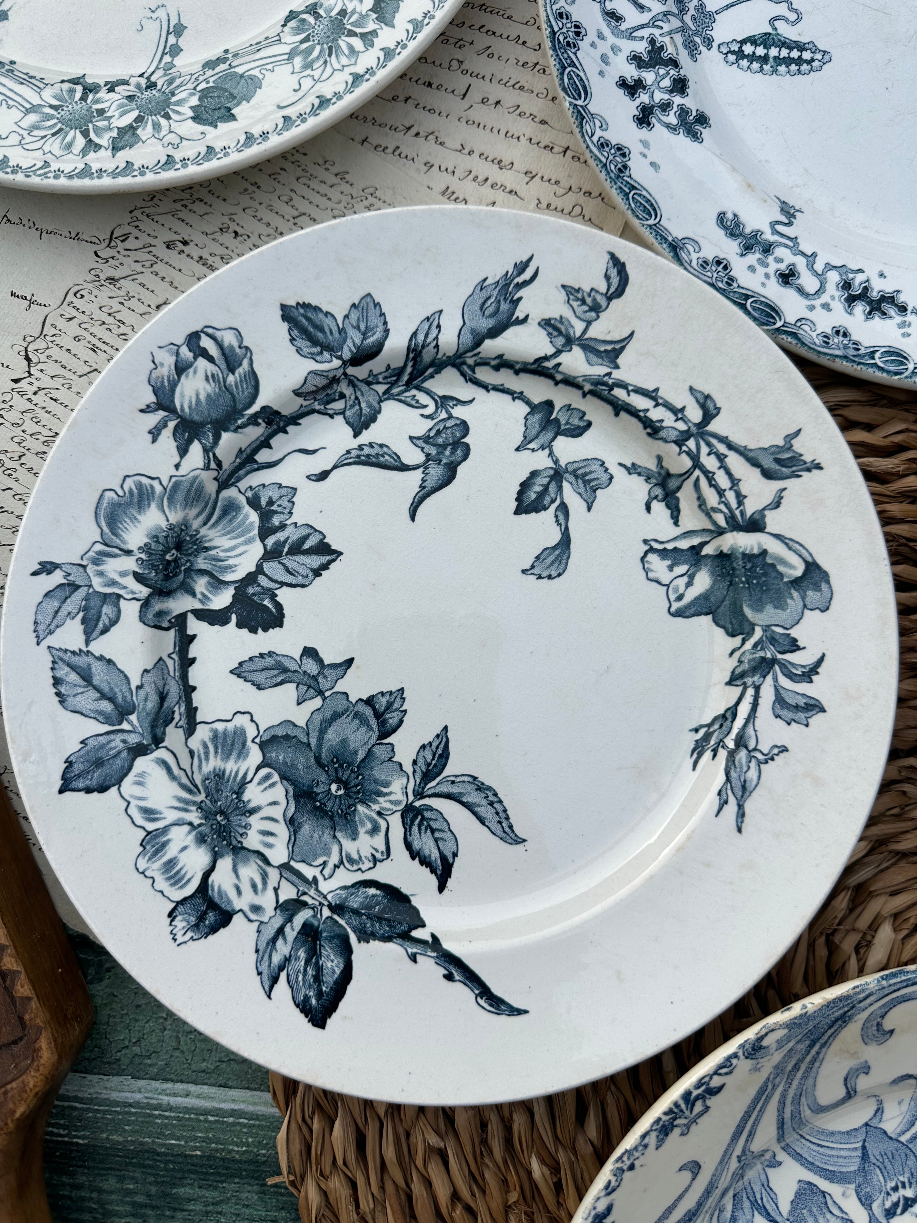 II. Set of 6 mismatched earthenware dinner plates