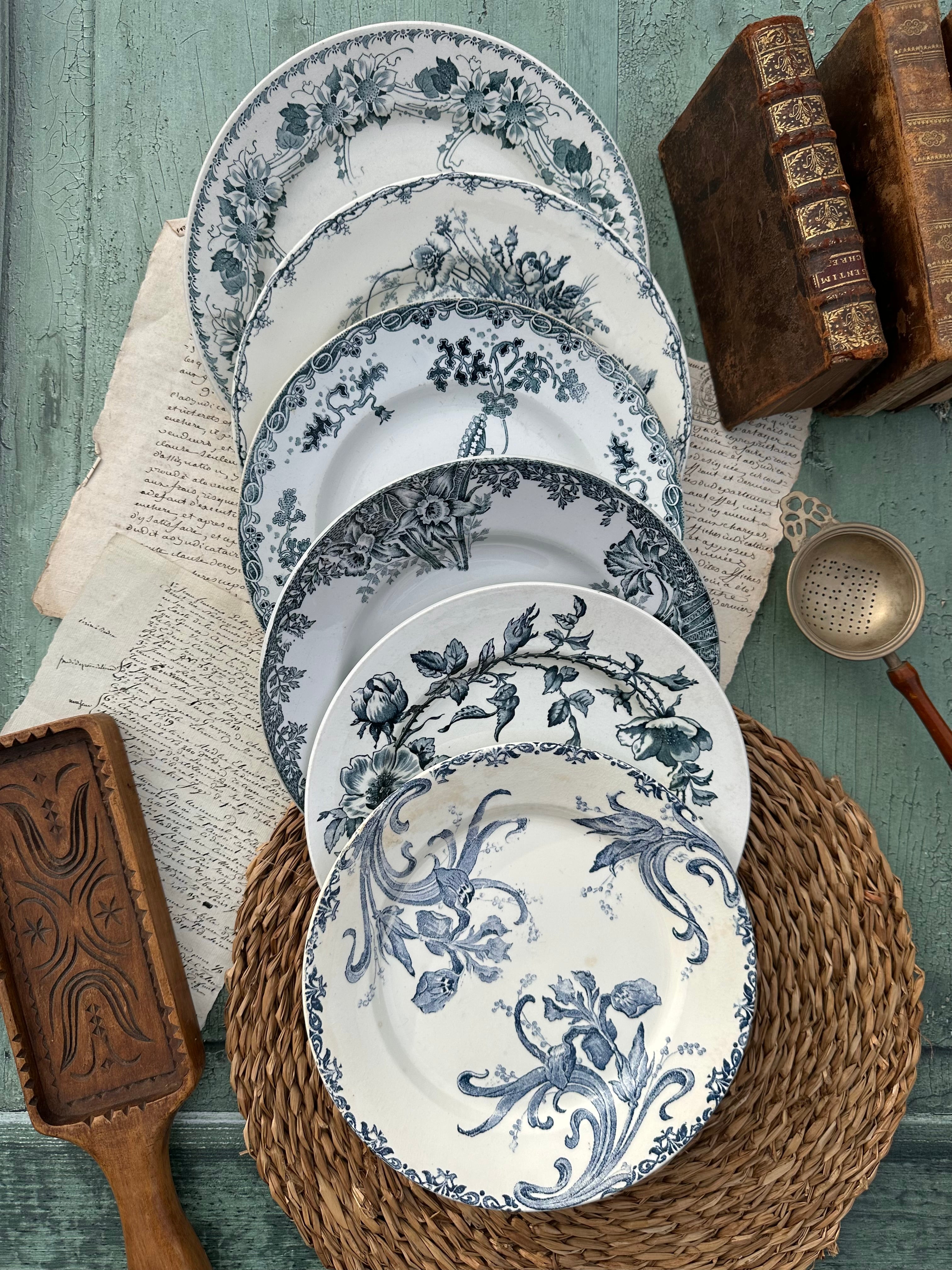 II. Set of 6 mismatched earthenware dinner plates