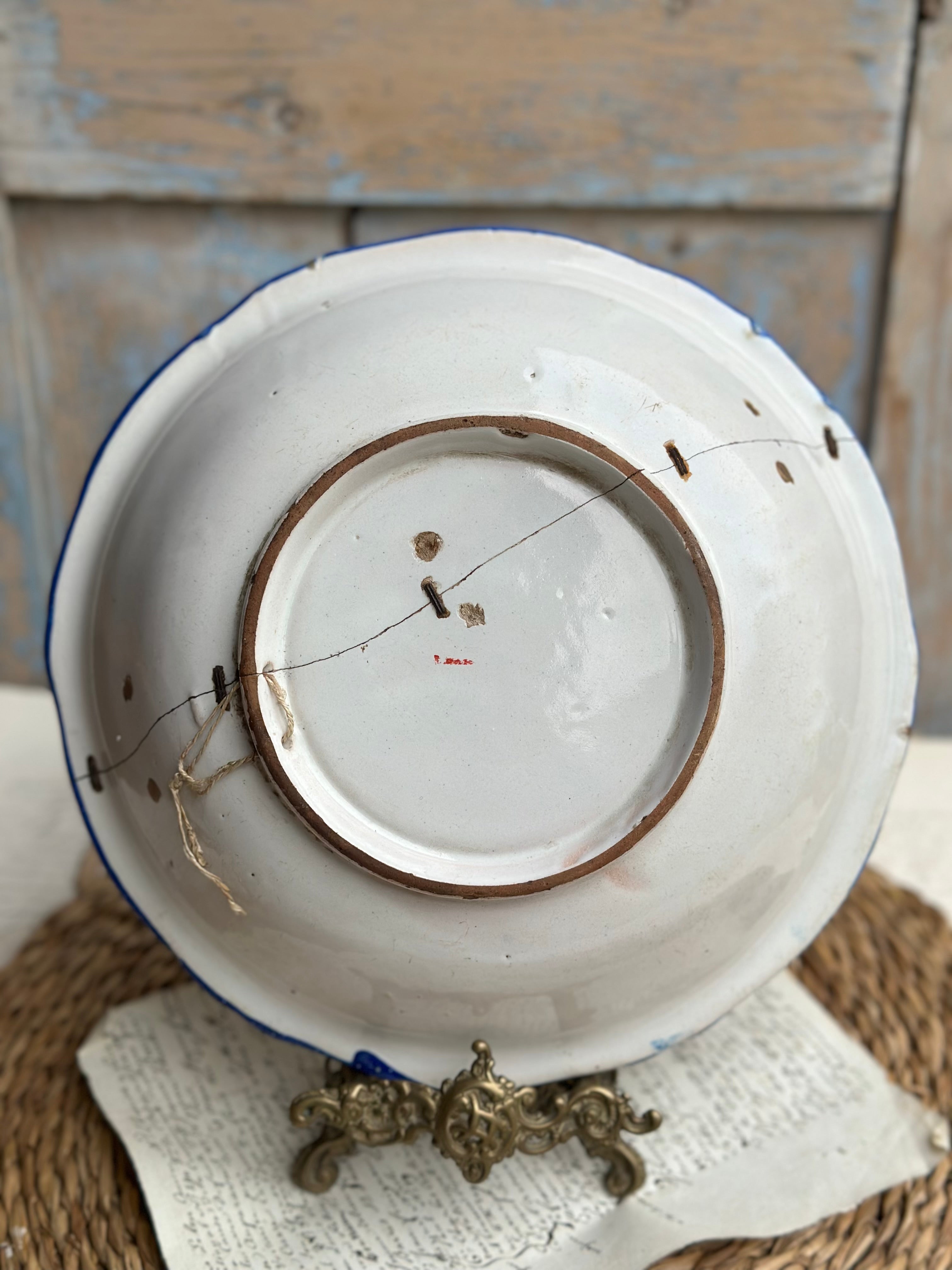 Small 19th-century salad bowl, repaired with staples