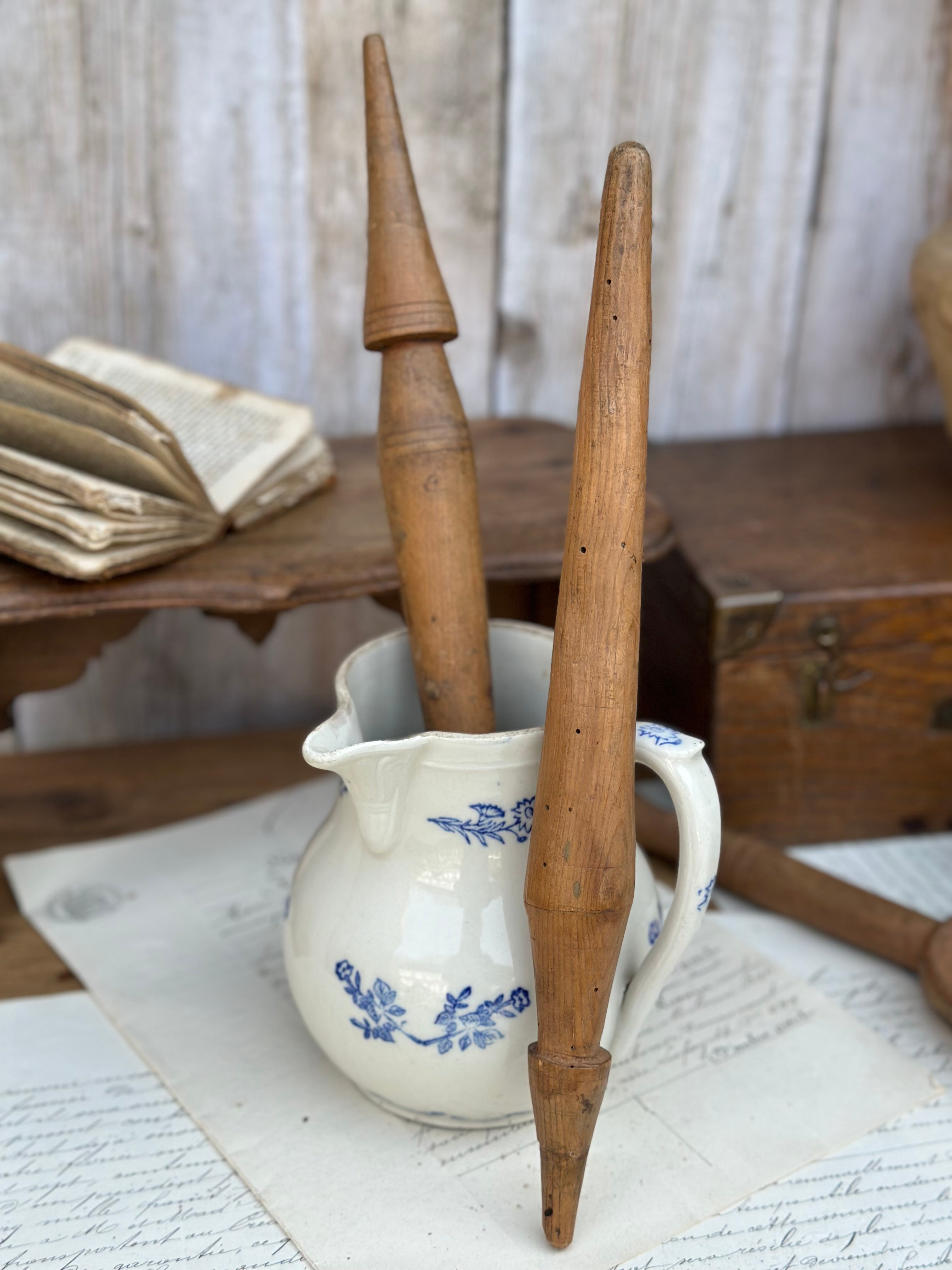 Two spindles for spinning wool