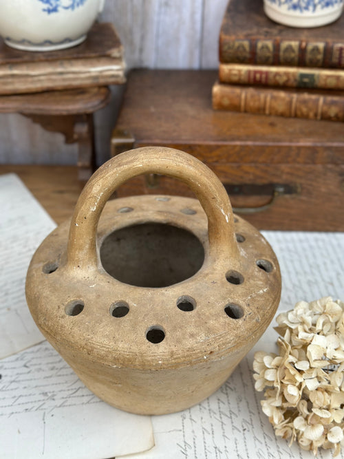 Old terracotta foot warmer