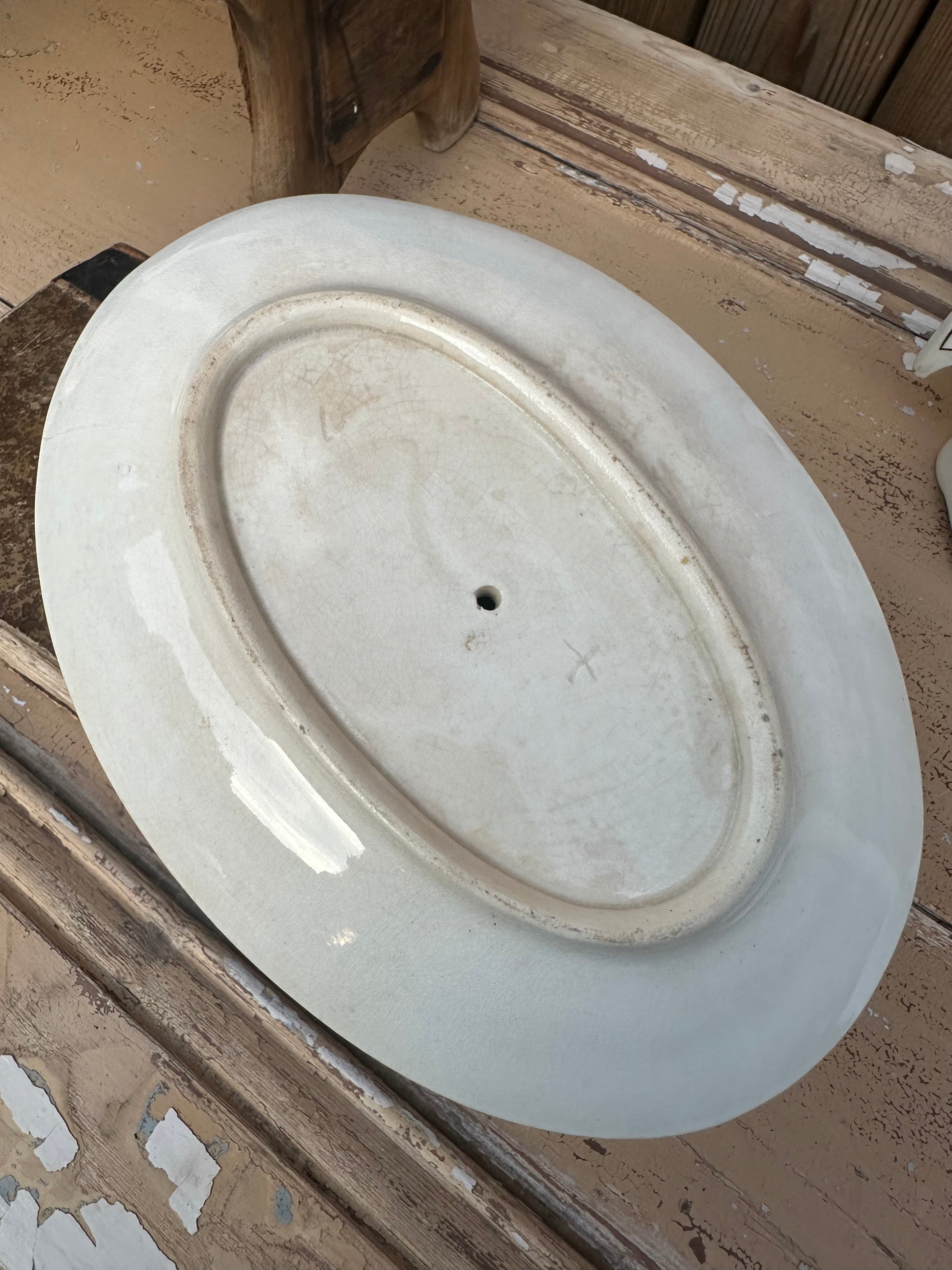 Patinated ironstone gravy boat