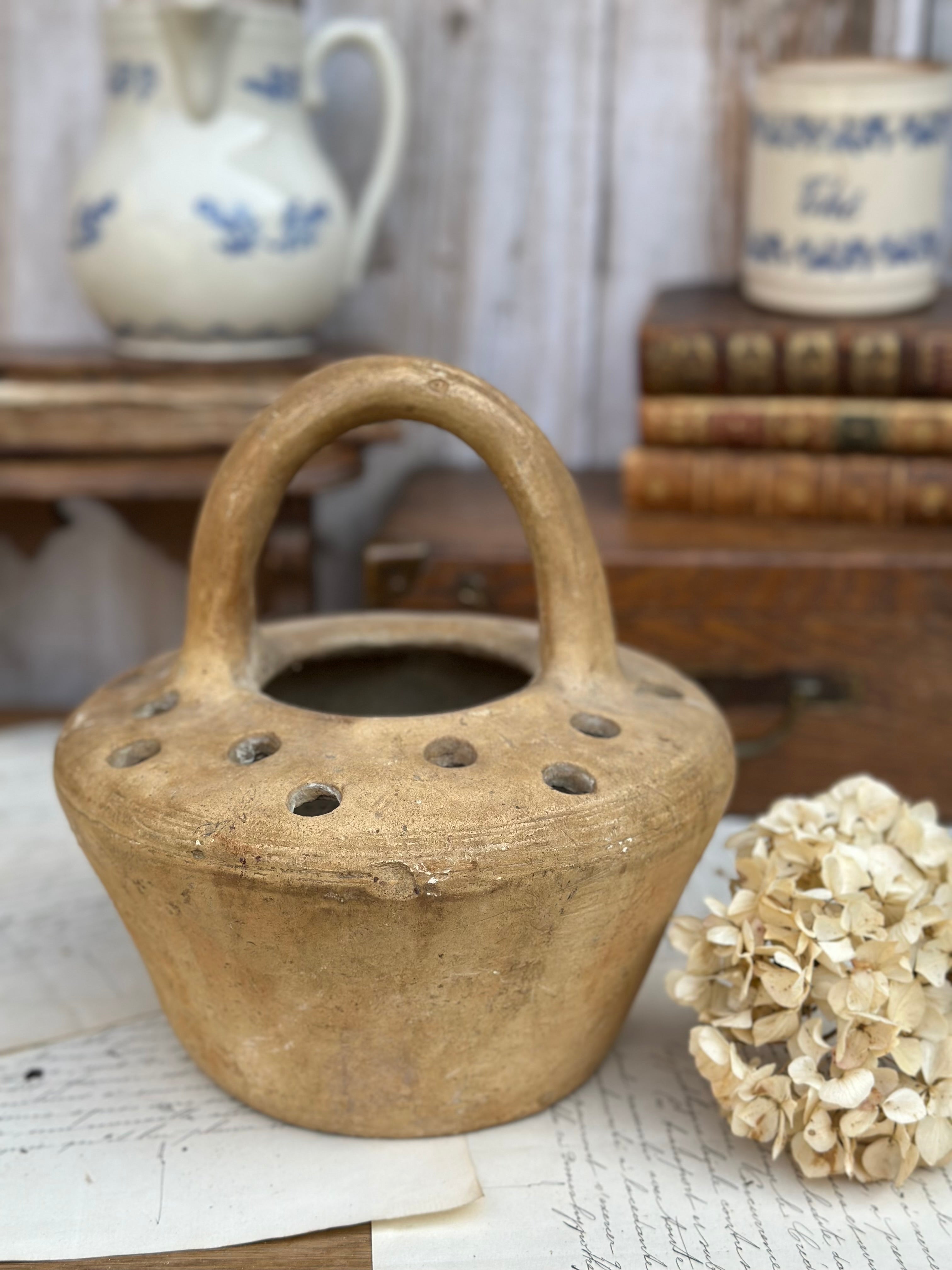 Old terracotta foot warmer