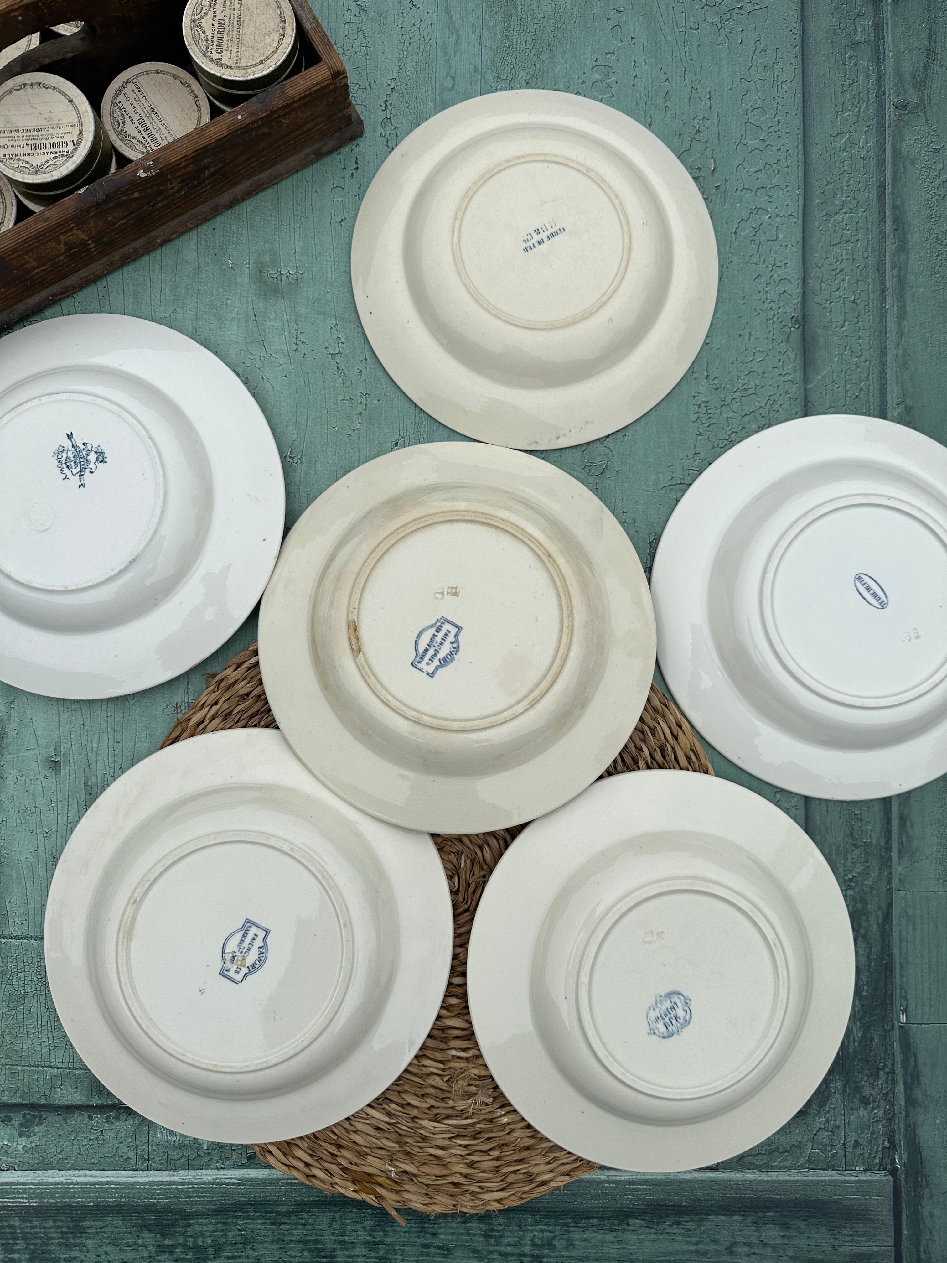 II. Set of 6 mismatched ironstone soup plates