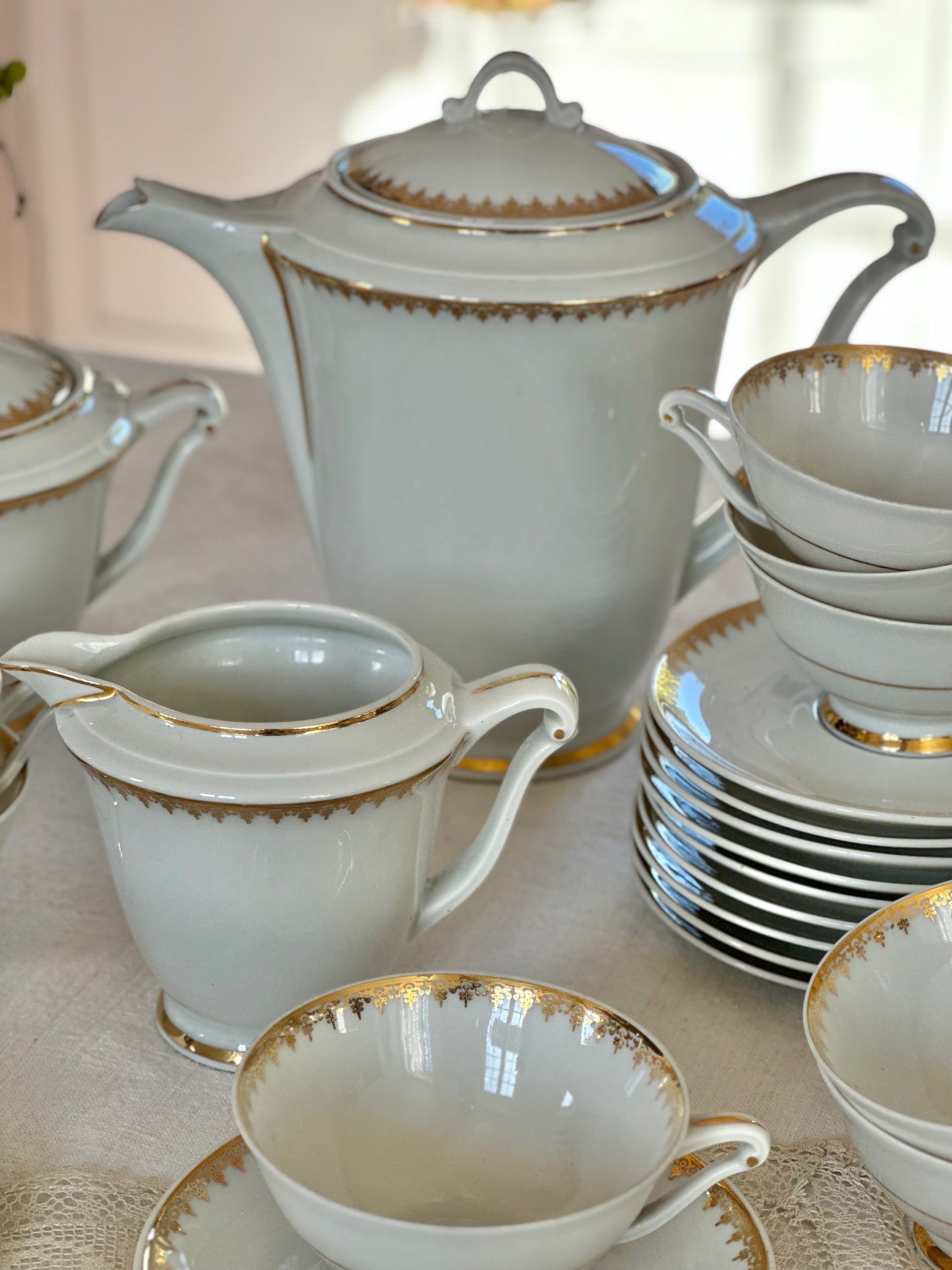 Tea service for 12 people in UC Limoges porcelain, white with a delicate gold rim