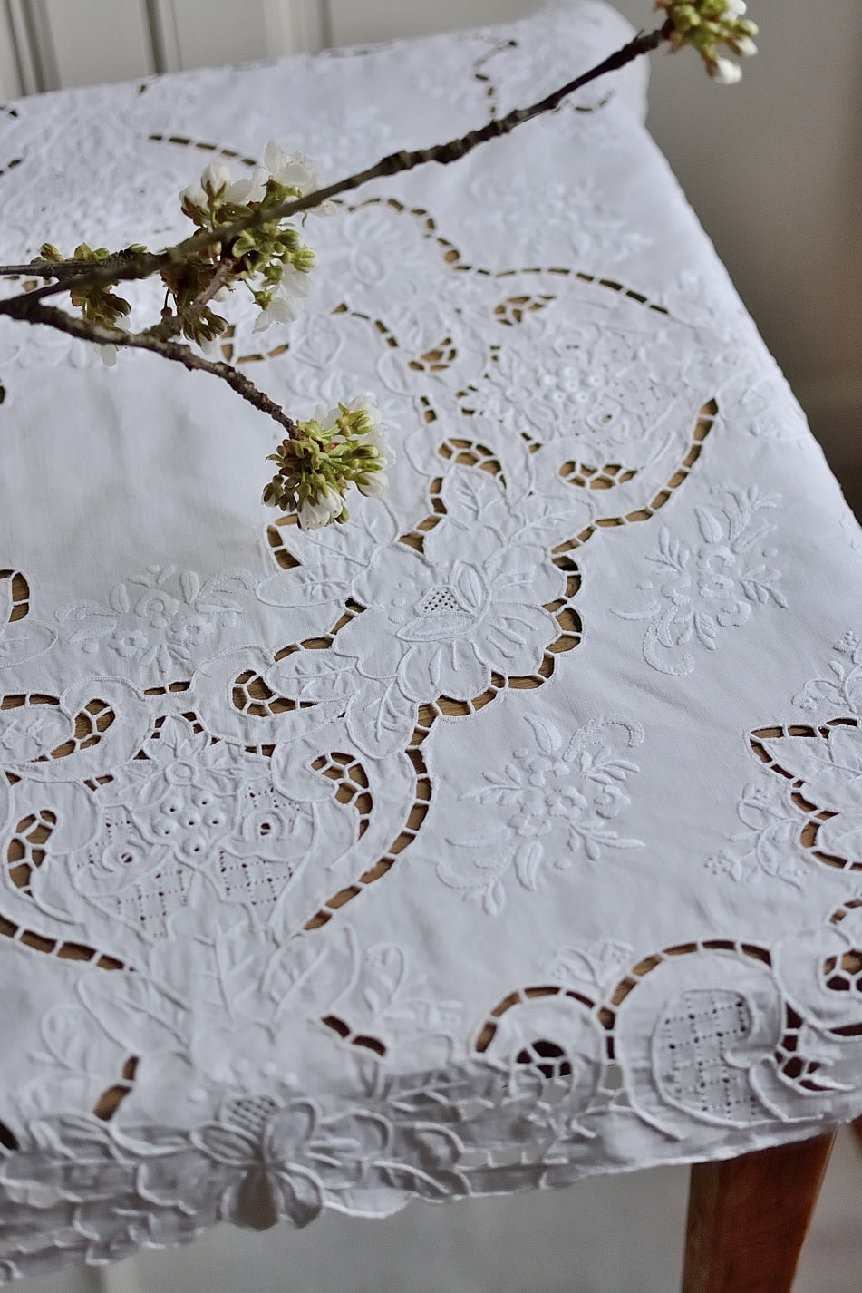 Small, richly embroidered tablecloth