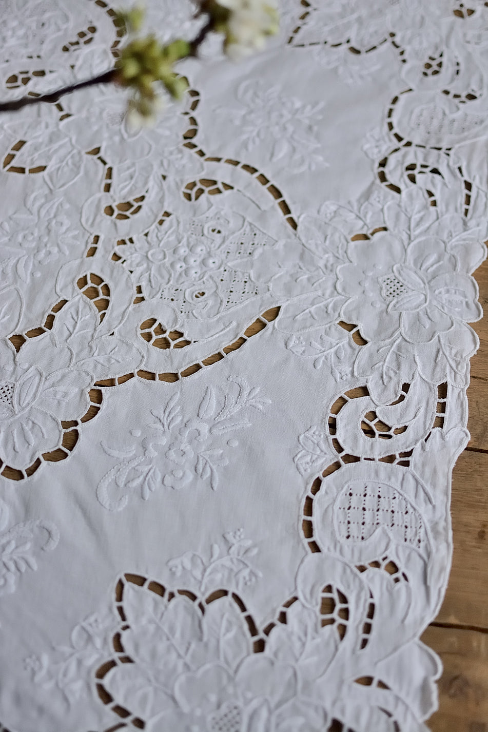 Small, richly embroidered tablecloth