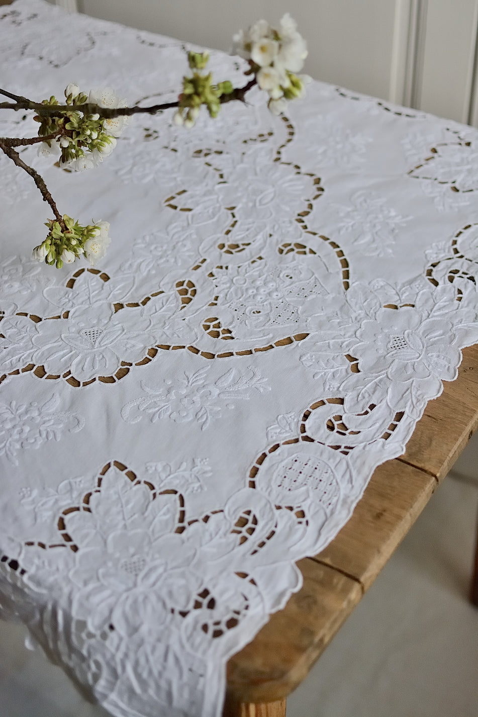 Small, richly embroidered tablecloth