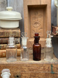 Set of 4 mini apothecary bottles, different shapes, heart-shaped stoppers