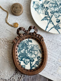 Carved wooden frame and ironstone Hollyhocks