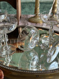 Exceptional set of four antique crystal champagne coupes with discreetly gilded motifs.