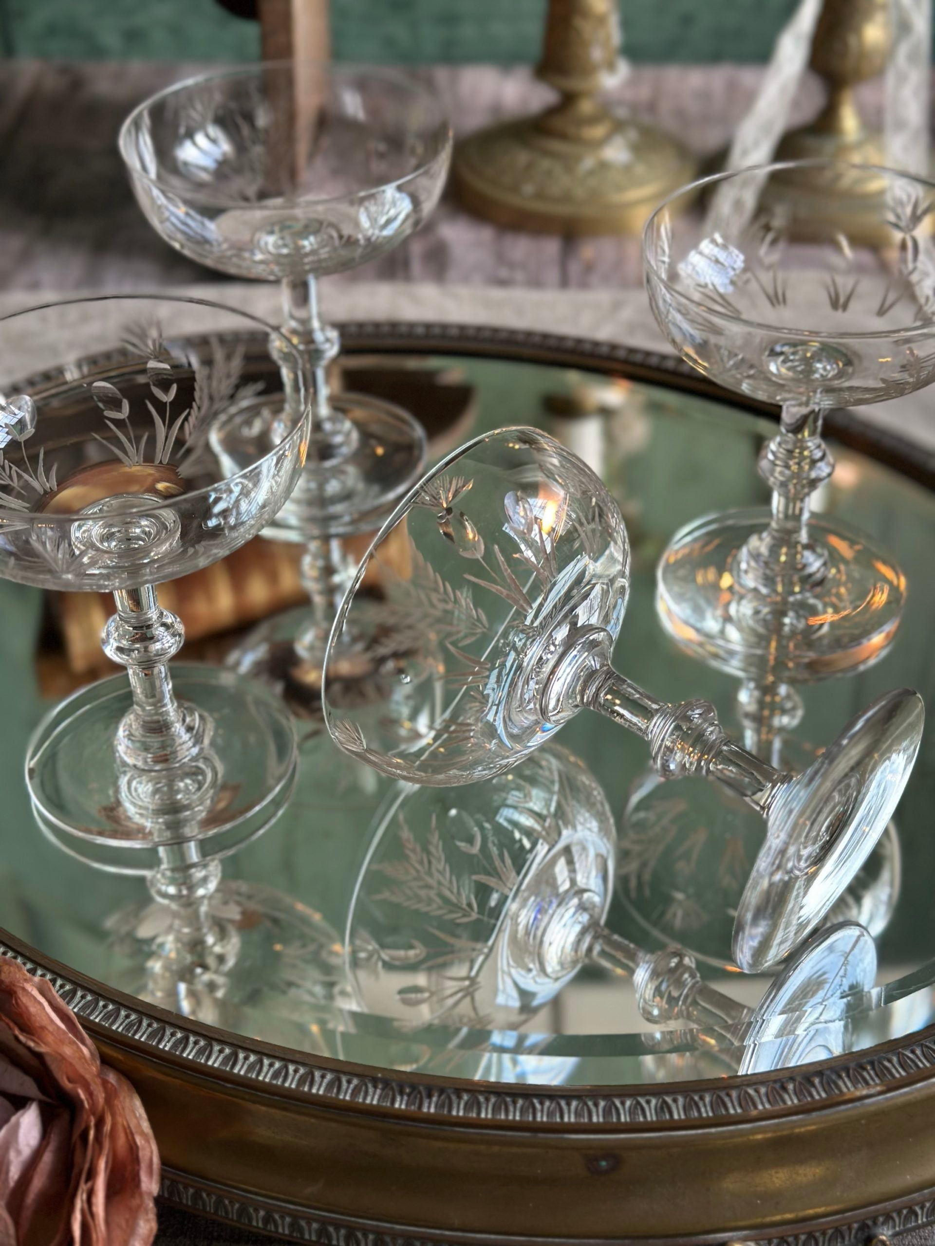 Exceptional set of four antique crystal champagne coupes with discreetly gilded motifs.