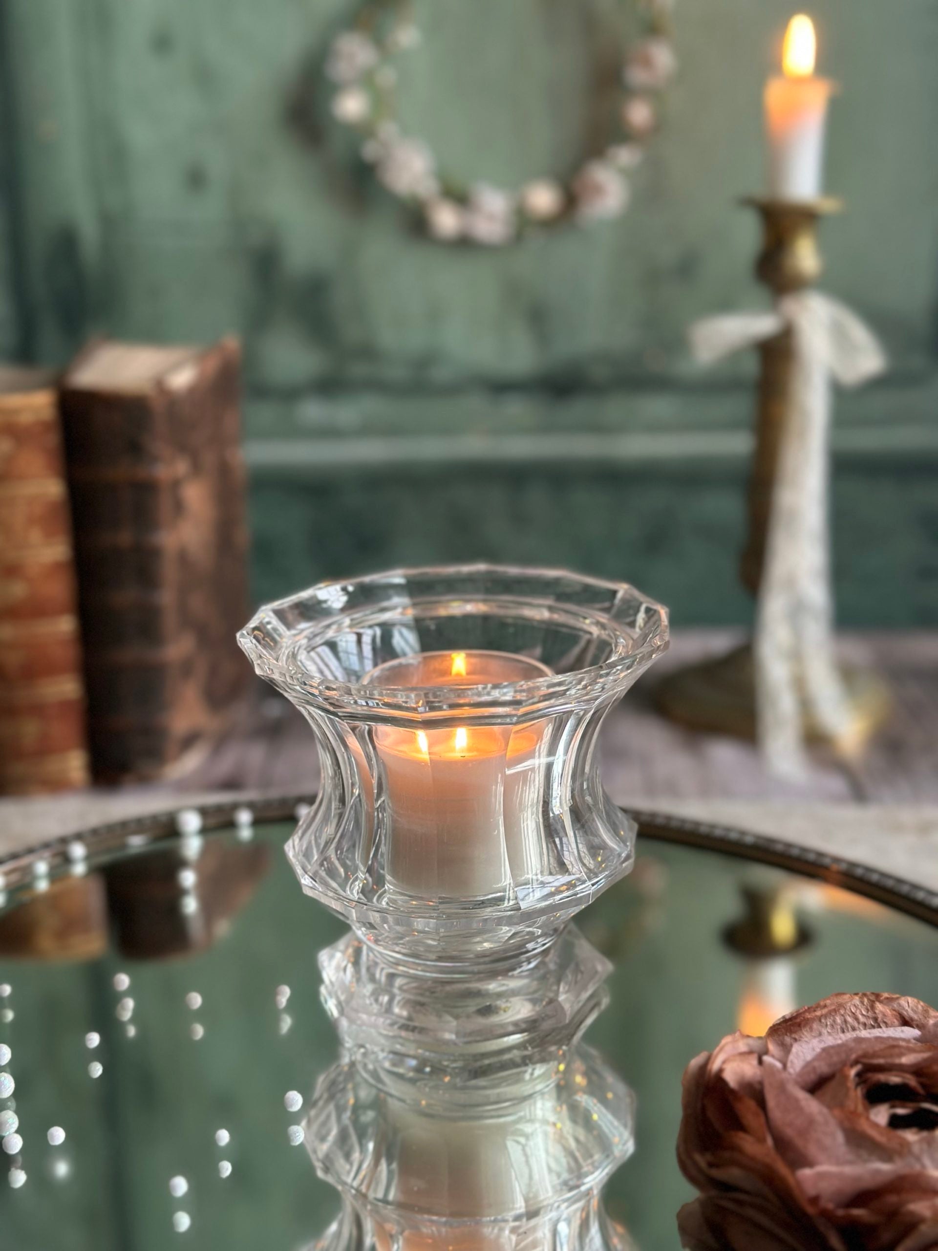 A candle holder or a small crystal vase