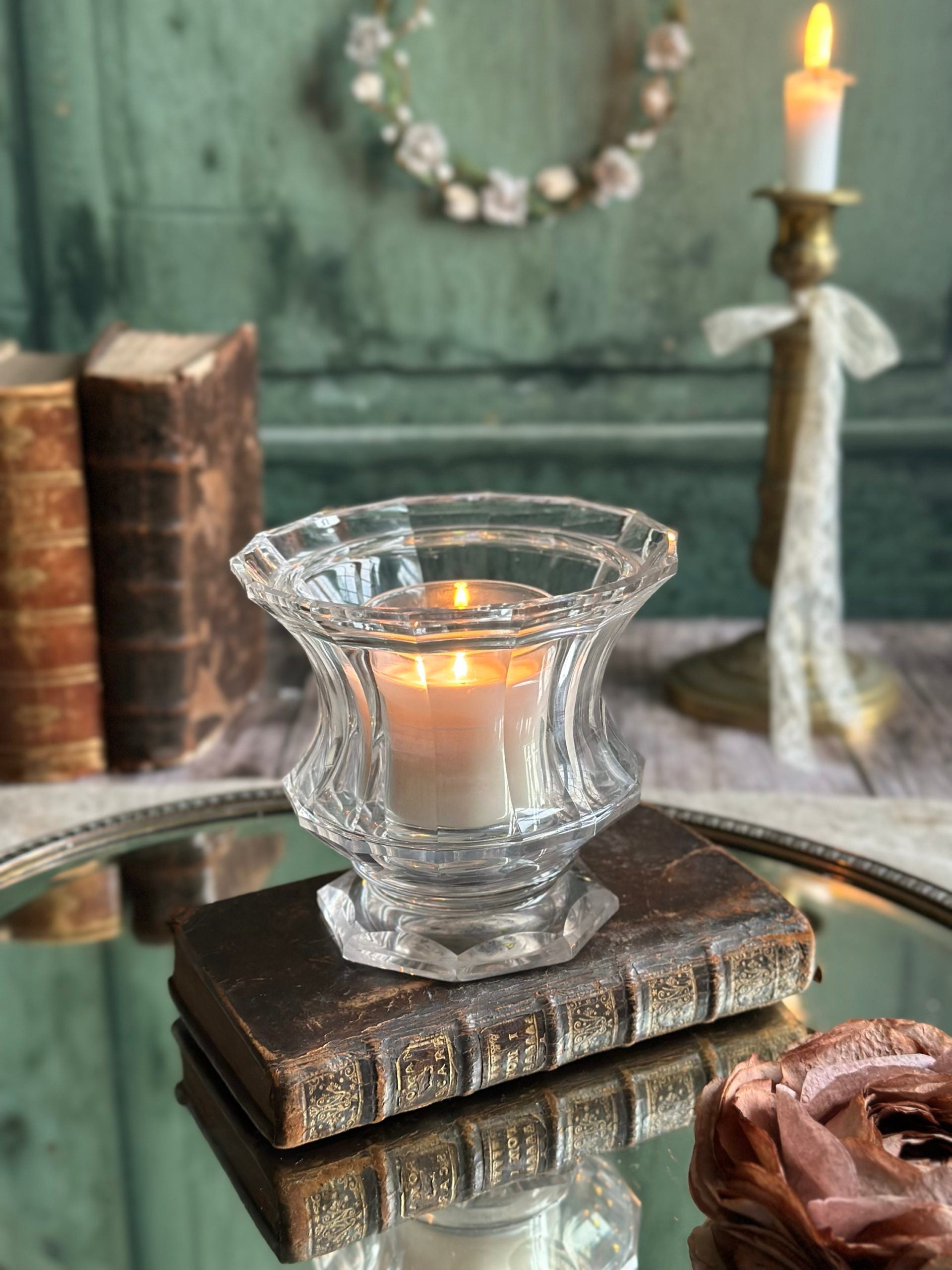 A candle holder or a small crystal vase