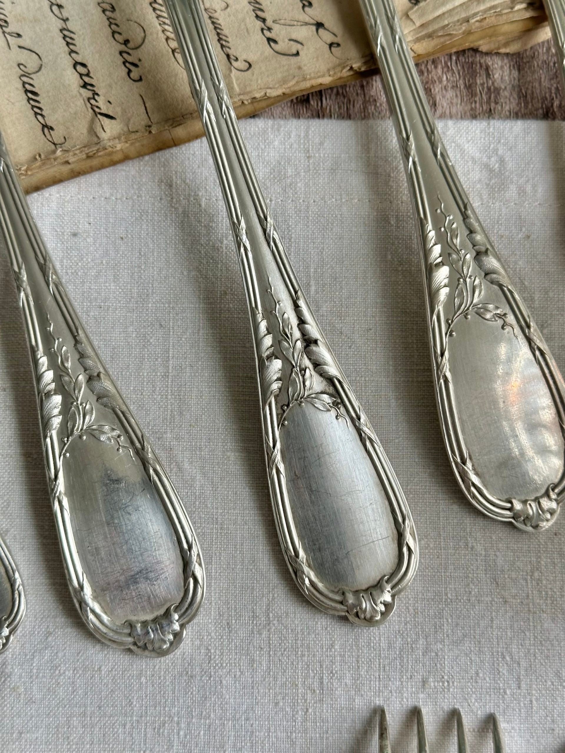 36-piece flatware set by ERCUIS silversmiths