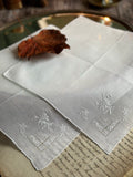 IX. Two antique hand-embroidered handkerchiefs