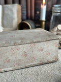 V. Antique sewing box covered in fabric