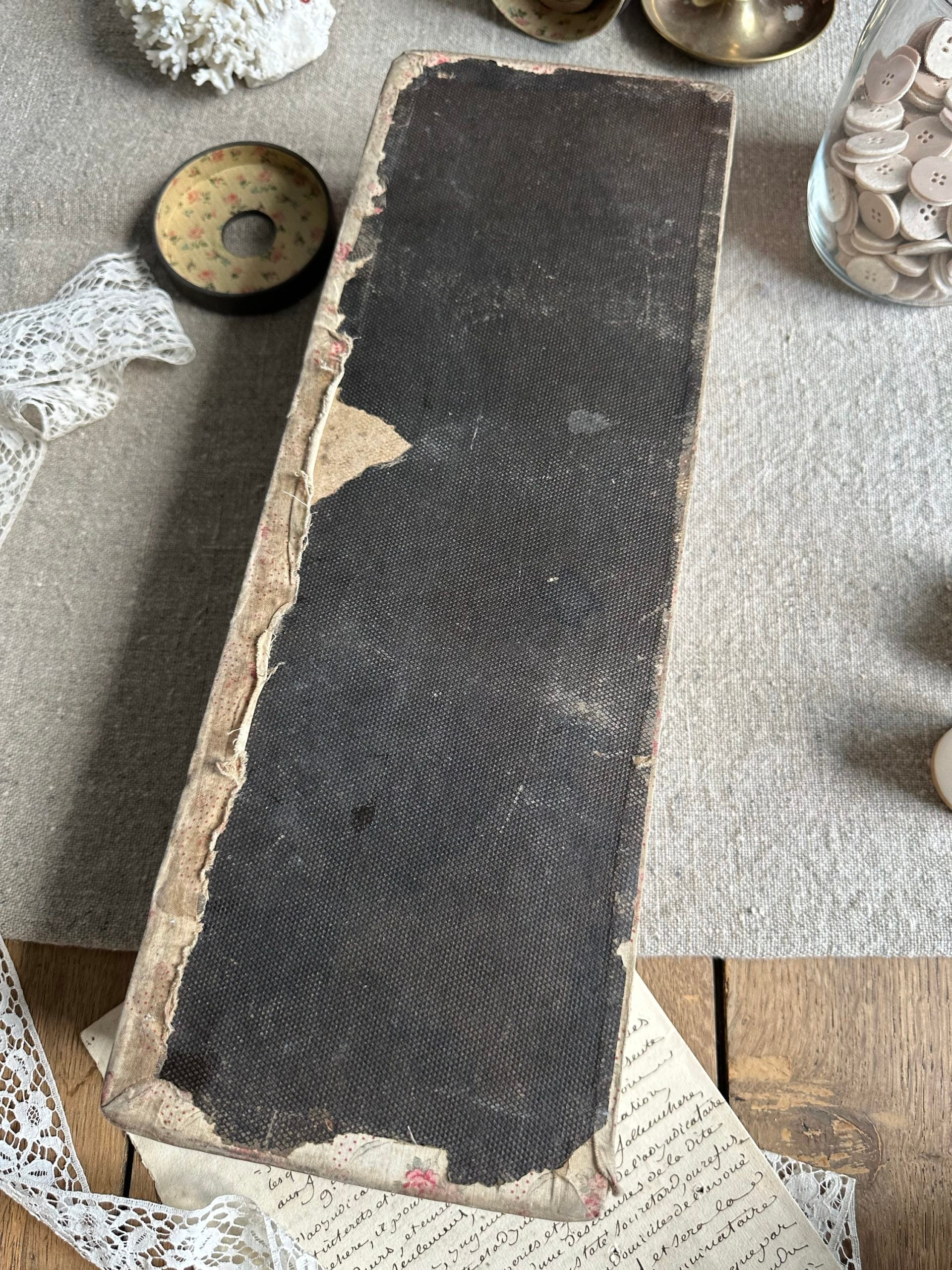 V. Antique sewing box covered in fabric