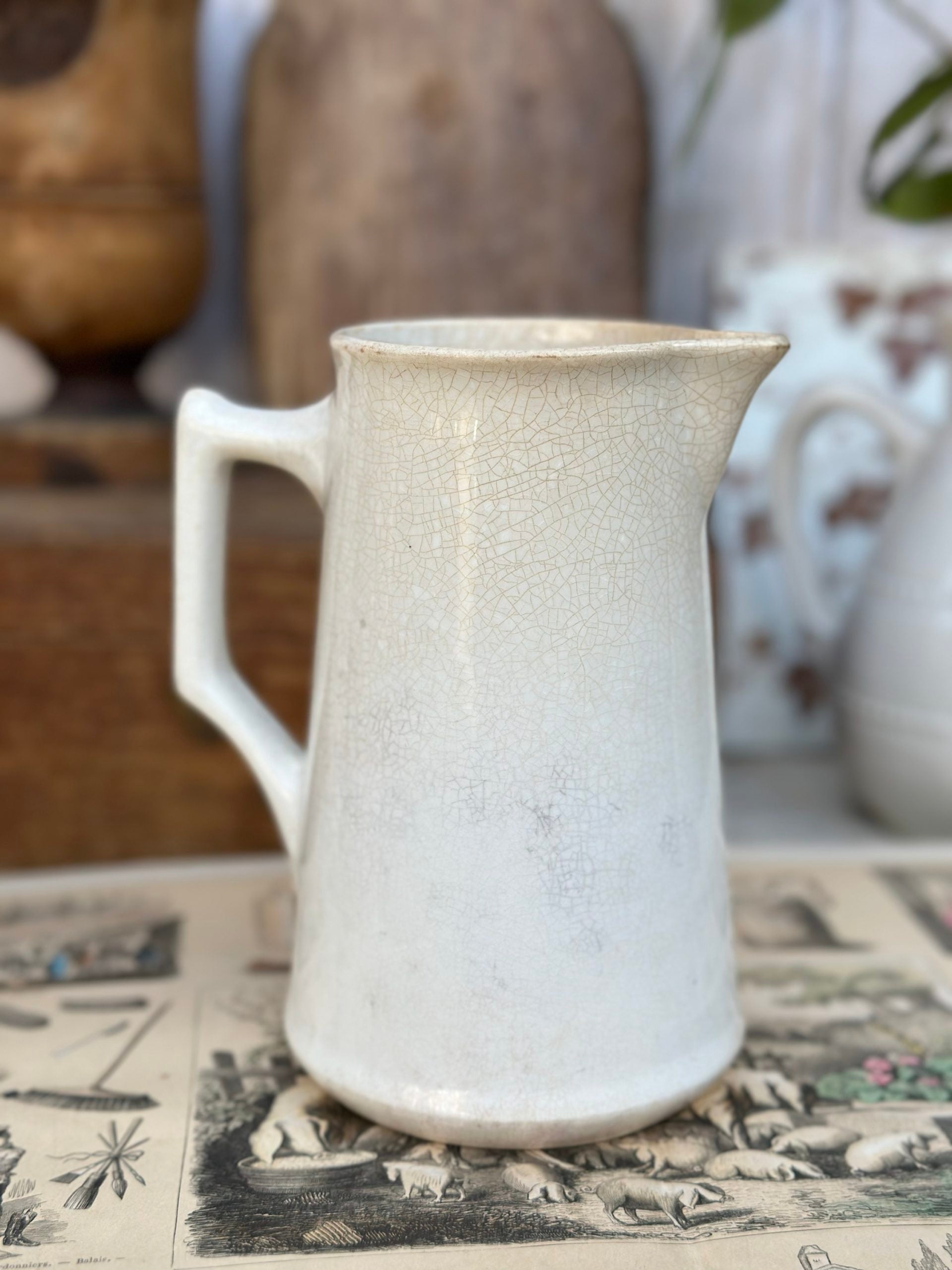 Patinated pitcher from Creil and Montereau