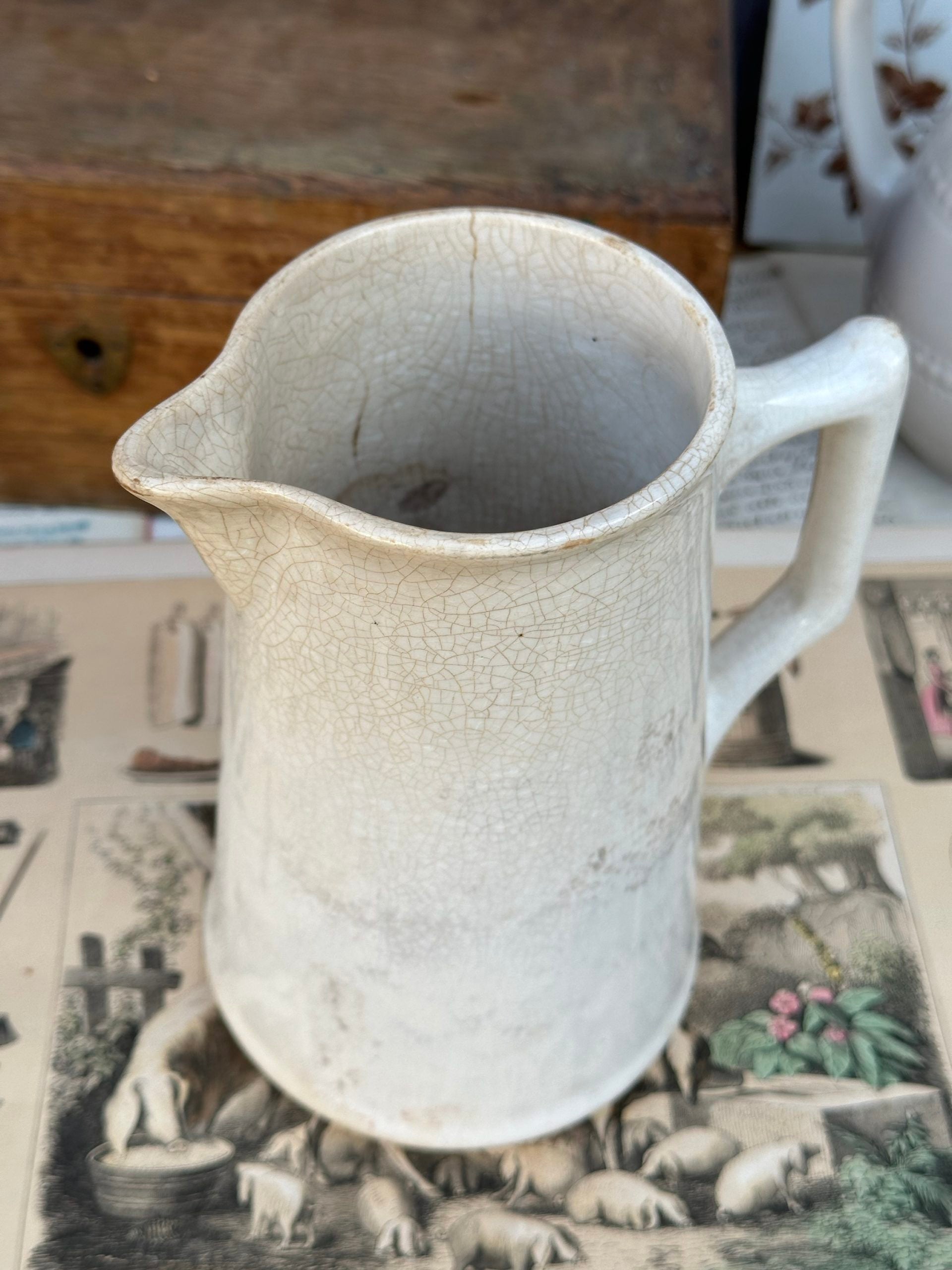 Patinated pitcher from Creil and Montereau