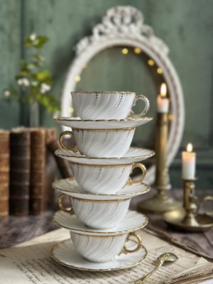 Ensemble de 5 tasses et sous-tasses en porcelaine Sarreguemines, XIXème