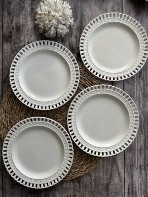 Suite de quatre assiettes ajourées + assiette ajourée Luneville